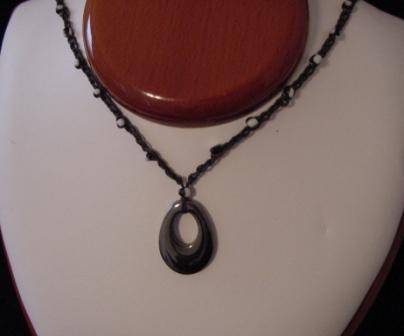 Black w/black & white beaded & crocheted necklace w/oval hematite